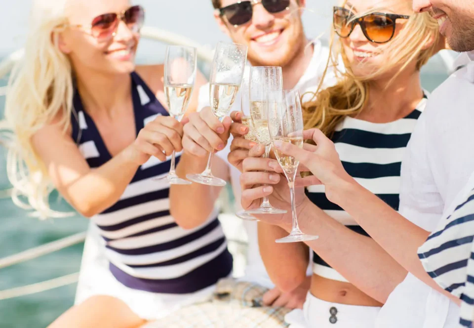 Women enjoing a glass of champagne on a Noosa River BBQ Pontoon Boat hired from Terrace Marina